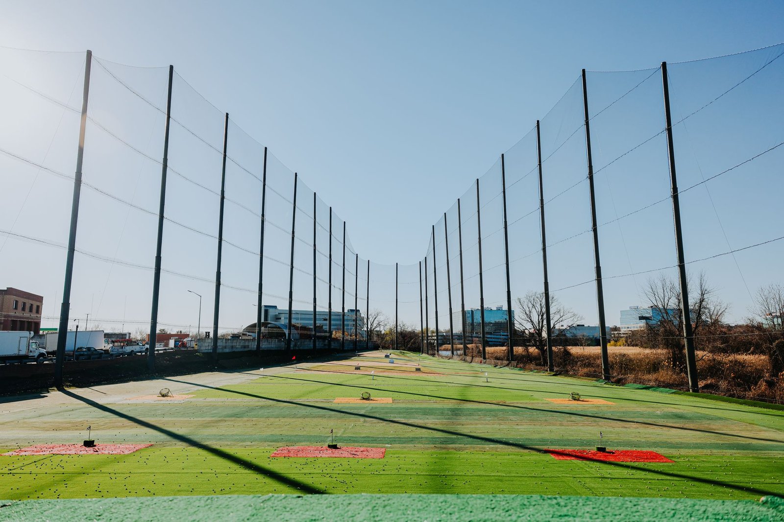 21 Golf Range teeing field wide view with Toptracer targets and netting, Palisades Park NJ